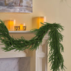 6-foot artificial Norfolk Pine garland featuring realistic-touch winter pine foliage.